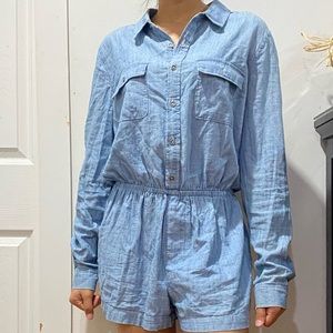 a blue short button up romper